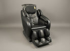 Black massage chair on a gray background