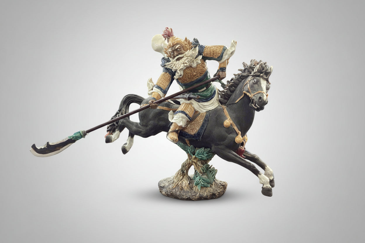 Figurine of a warrior on horseback with a spear against a beige background
